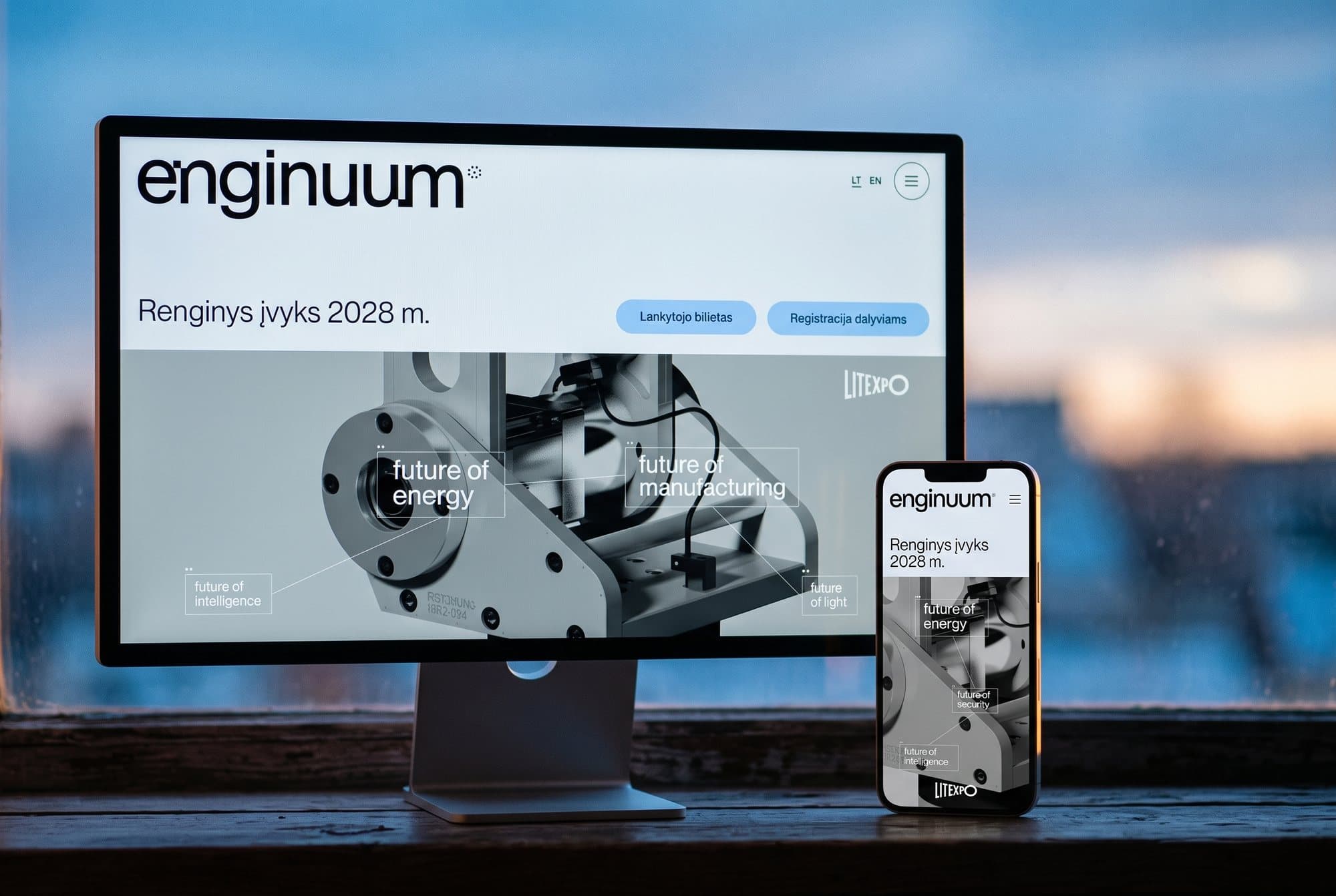 The Enginuum website on a monitor and a phone