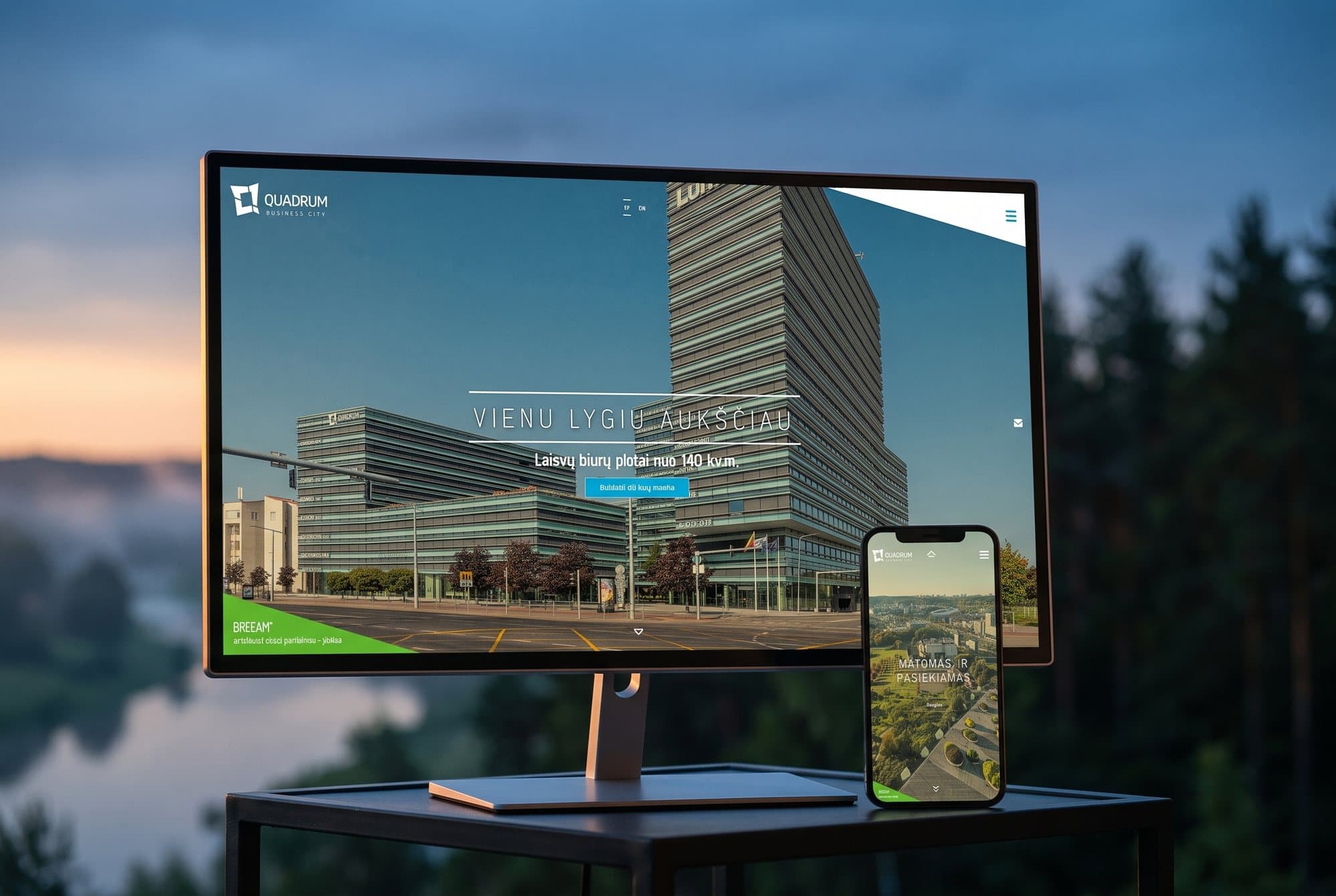 The Quadrum website on a monitor and a phone